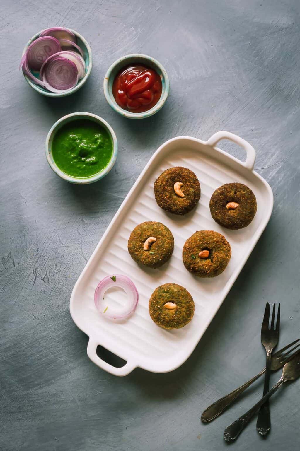 Hara bhara kabab are soft patties made with pureed spinach and peas. Serve them as appetisers or as an evening snack along with hot piping chai or tea. 
